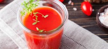 Tomato juice in glass with cress salad, tomatoes